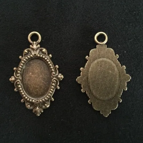 Pendentif support cabochon ovale 18x13 mm filigrané bronze antique